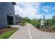 Walking path along landscaped community buildings with well-maintained landscaping at 6775 Pippin Walk, Alpharetta, GA 30005