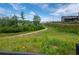 Community walking trail through natural landscape with native plantings at 6775 Pippin Walk, Alpharetta, GA 30005