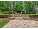 Beautiful stone patio and terraced landscaping create a serene outdoor retreat at 2551 Raintree Ne Dr, Atlanta, GA 30345