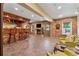 Finished basement with a custom brick bar, fireplace, and recreation space at 2551 Raintree Ne Dr, Atlanta, GA 30345