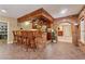 Basement bar area with brick accents, wooden bar, and comfortable seating at 2551 Raintree Ne Dr, Atlanta, GA 30345