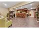Entertainer's finished basement featuring a full bar, tile floors and recessed lighting at 2551 Raintree Ne Dr, Atlanta, GA 30345