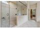 Spacious shower with seamless glass door, double shower heads and tiled walls at 2551 Raintree Ne Dr, Atlanta, GA 30345