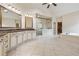 Bright bathroom showcasing tile floors, dual vanities, large shower, and separate soaking tub at 2551 Raintree Ne Dr, Atlanta, GA 30345