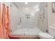 Modern bathroom featuring a glass-enclosed shower with white tile and sleek fixtures at 2551 Raintree Ne Dr, Atlanta, GA 30345