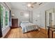 Bedroom with wood floors, natural light from window, and ceiling fan at 2551 Raintree Ne Dr, Atlanta, GA 30345