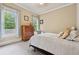 Cozy bedroom with carpet, large window with curtains, and a wooden dresser at 2551 Raintree Ne Dr, Atlanta, GA 30345