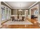 Formal dining room showcasing hardwood floors, natural light, and elegant furnishings at 2551 Raintree Ne Dr, Atlanta, GA 30345