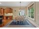 Bright dining room with hardwood floors, a window, and a stylish chandelier at 2551 Raintree Ne Dr, Atlanta, GA 30345