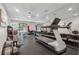 Well-equipped home gym with modern exercise equipment and mirrored wall at 2551 Raintree Ne Dr, Atlanta, GA 30345