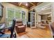Bright office area featuring hardwood floors, a decorative ceiling, and views to the dining area at 2551 Raintree Ne Dr, Atlanta, GA 30345
