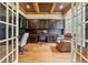 Stylish home office with custom cabinetry, wood floors, and an elegant coffered ceiling at 2551 Raintree Ne Dr, Atlanta, GA 30345