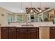 Gourmet kitchen featuring granite countertops, a stainless steel dishwasher, and a breakfast area at 2551 Raintree Ne Dr, Atlanta, GA 30345