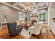 Elegant living room featuring a coffered ceiling, fireplace, and hardwood floors at 2551 Raintree Ne Dr, Atlanta, GA 30345