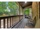 Relaxing screened porch with wooden floors and views of the private backyard at 2551 Raintree Ne Dr, Atlanta, GA 30345