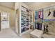 Spacious walk-in closet with custom shelving, ample storage, and carpeted floor at 2551 Raintree Ne Dr, Atlanta, GA 30345