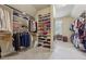 Organized walk-in closet with custom shelving and ample storage for clothing and accessories at 2551 Raintree Ne Dr, Atlanta, GA 30345