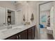 Bathroom featuring double sinks, marble countertops, and modern finishes at 4020 Declaration Dr, Roswell, GA 30076