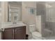 Updated bathroom featuring a glass shower, vanity with white countertop, and dark wood cabinets at 4020 Declaration Dr, Roswell, GA 30076