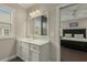 Bright bathroom with a white vanity, a large mirror, and lots of light; walk-in shower is visible through the doorway at 4020 Declaration Dr, Roswell, GA 30076