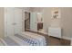 Bedroom with hardwood floors and closet, and ensuite bathroom at 4020 Declaration Dr, Roswell, GA 30076