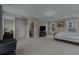 Large bedroom featuring neutral walls, carpet, and a view to a bathroom at 4020 Declaration Dr, Roswell, GA 30076