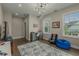 Spacious bedroom with hardwood floors, a large window, and modern lighting at 4020 Declaration Dr, Roswell, GA 30076