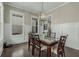 Stylish dining room with hardwood floors, wainscoting, and ample natural light from large windows at 4020 Declaration Dr, Roswell, GA 30076