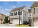 Exterior view of a two-story home with a two-car garage and a well-maintained lawn at 4020 Declaration Dr, Roswell, GA 30076