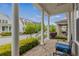 Inviting front porch with a swing and seating, offering a comfortable space to relax outdoors at 4020 Declaration Dr, Roswell, GA 30076