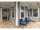 Charming front porch featuring a swing, seating, and a welcoming entrance to the home at 4020 Declaration Dr, Roswell, GA 30076