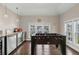 Bright game room featuring hardwood floors, natural light, foosball table, and a beverage fridge at 4020 Declaration Dr, Roswell, GA 30076