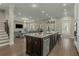 Open concept kitchen with a large center island, stainless steel appliances, and hardwood floors at 4020 Declaration Dr, Roswell, GA 30076