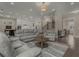 Open-concept living room with hardwood floors, neutral tones, and seamless flow to the kitchen at 4020 Declaration Dr, Roswell, GA 30076