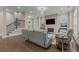 Spacious living room featuring hardwood floors, a fireplace, and a staircase at 4020 Declaration Dr, Roswell, GA 30076
