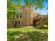 Brick house with beautiful three-story deck overlooking a lush, green backyard at 4746 Chamblee Dunwoody Rd, Atlanta, GA 30338