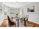 Bright dining room with a glass-top table, comfortable seating, and natural light at 4746 Chamblee Dunwoody Rd, Atlanta, GA 30338