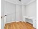 Small home office featuring built-in desk and hardwood floors at 4746 Chamblee Dunwoody Rd, Atlanta, GA 30338