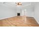 Bright living room with hardwood floors, fireplace, and decorative trim at 4746 Chamblee Dunwoody Rd, Atlanta, GA 30338