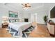 Comfortable main bedroom with hardwood floors, fireplace, and stylish decor at 4746 Chamblee Dunwoody Rd, Atlanta, GA 30338