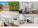 Showcasing the home's exterior, living room, dining room, and kitchen in a single image at 4746 Chamblee Dunwoody Rd, Atlanta, GA 30338