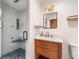 Updated bathroom featuring a glass-enclosed shower and modern vanity at 10192 Shallowford Rd, Roswell, GA 30075