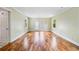 Bright living room with hardwood floors and French doors leading to outdoor space at 10192 Shallowford Rd, Roswell, GA 30075
