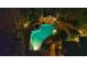 Aerial view showing the backyard pool with a poolhouse, surrounded by trees and stonework at 3 Demorest Ne Ave, Atlanta, GA 30305