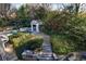 Relaxing backyard retreat with a swimming pool, spa, stone patio, and gazebo for outdoor enjoyment at 3 Demorest Ne Ave, Atlanta, GA 30305