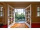 Charming balcony view through french doors with green lush landscaping views at 3 Demorest Ne Ave, Atlanta, GA 30305