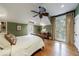 Bright bedroom with hardwood floors, ceiling fan, and large windows with backyard views at 3 Demorest Ne Ave, Atlanta, GA 30305