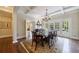 Elegant dining room with coffered ceiling, chandelier, and access to outdoor space at 3 Demorest Ne Ave, Atlanta, GA 30305
