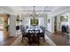 Large dining room with chandelier and access to outdoor patio and living area at 3 Demorest Ne Ave, Atlanta, GA 30305