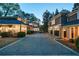 An elegant home with a circular driveway and multiple car garage offers ample parking and curb appeal at 3 Demorest Ne Ave, Atlanta, GA 30305